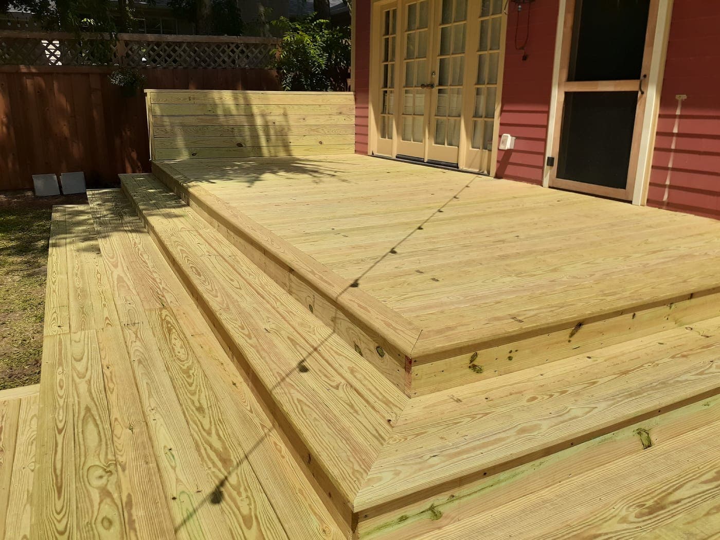 Composite Trex deck in Frisco, TX — multi-level with cedar pergola