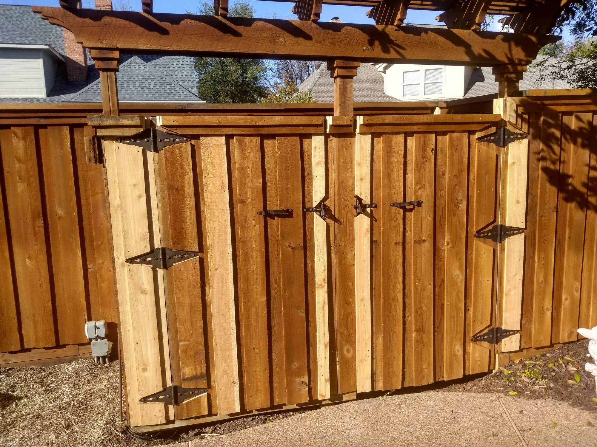 Custom cedar board-on-board fence built by Woodchuck Millwork in Allen, TX